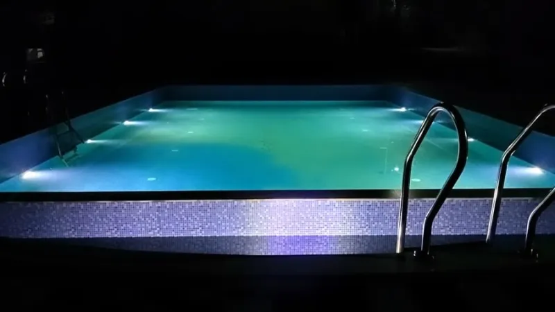 Swimming pool lit up at night