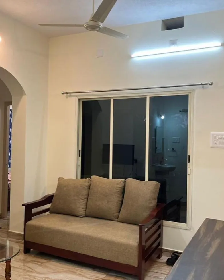 Living room with a sofa and sliding glass doors