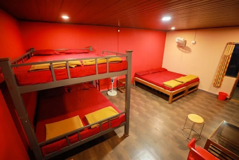 Room with a bunk bed and a double bed